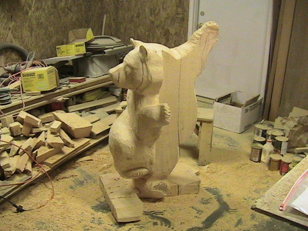 Wooden sculpture of a bear before it was painted or fully carved