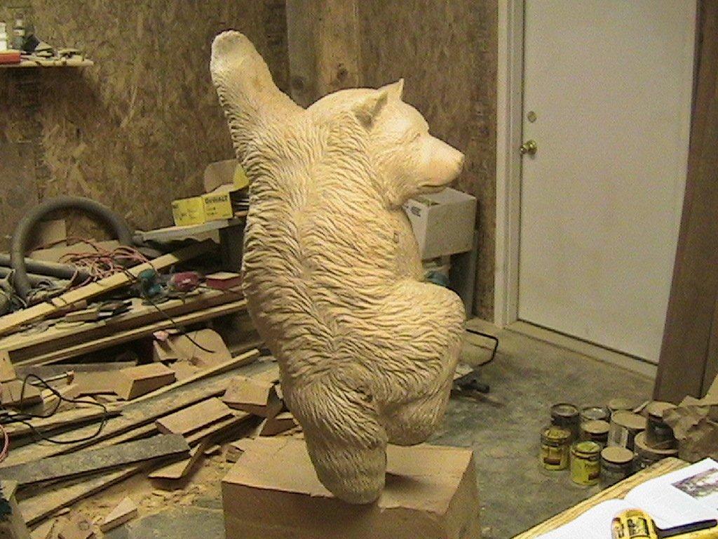 Wooden sculpture of a bear before it was painted