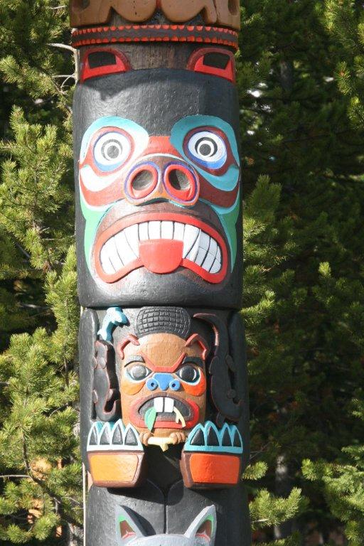 Totem pole segments depicting several creatures, including a beaver